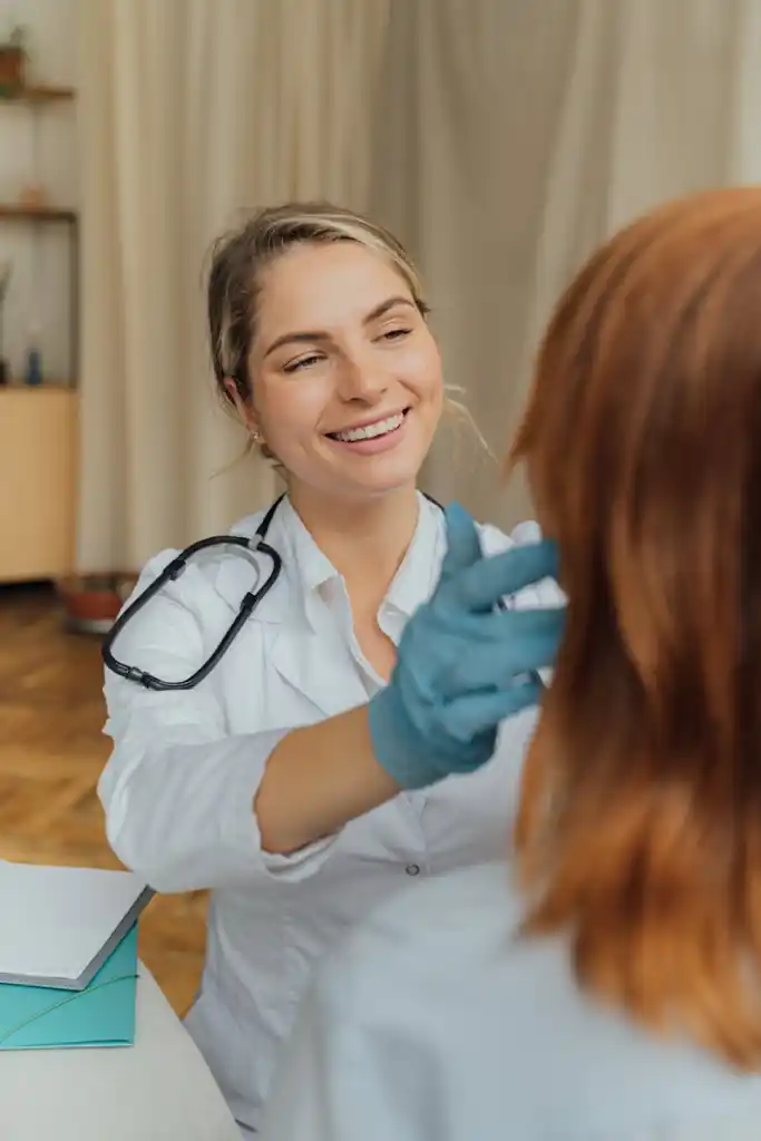 a woman in white long sleeve shirt smiling