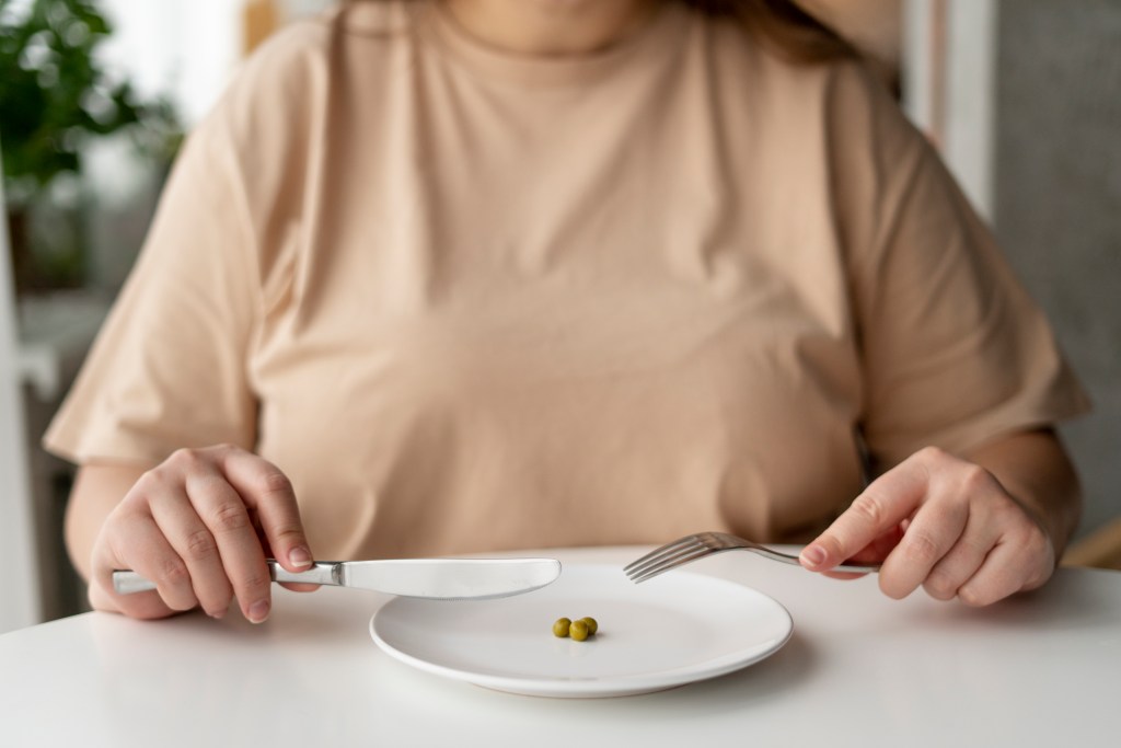 person with eating disorder trying eat healthy