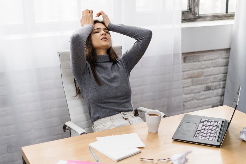 businesswoman looking frustrated while working from home