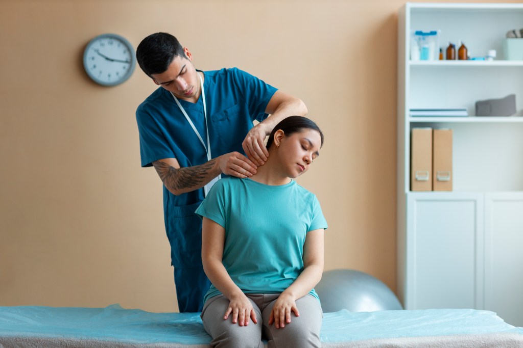 doctor helping patient rehabilitation